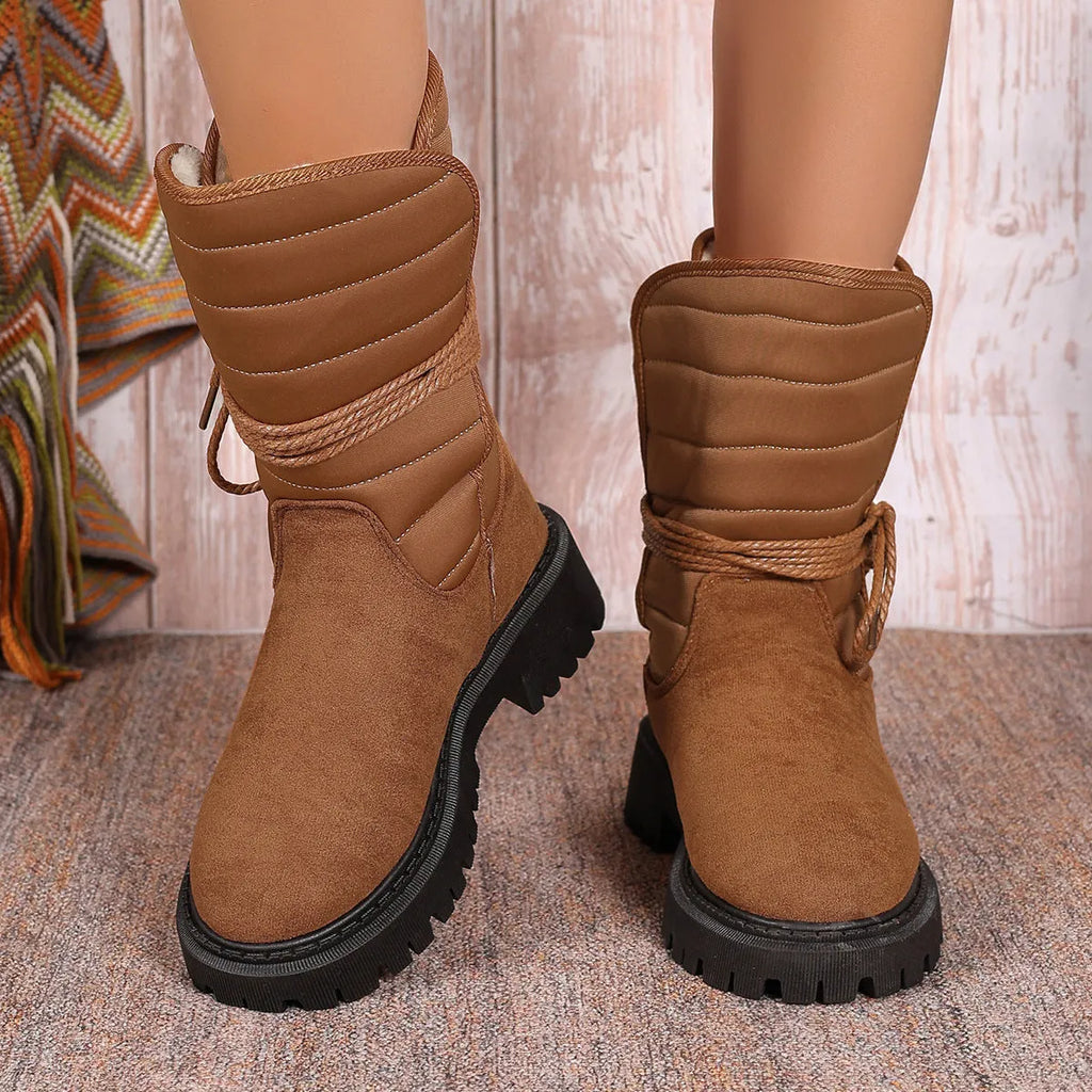 Women's black chunky heel snow boots with lace-up front and fleece lining