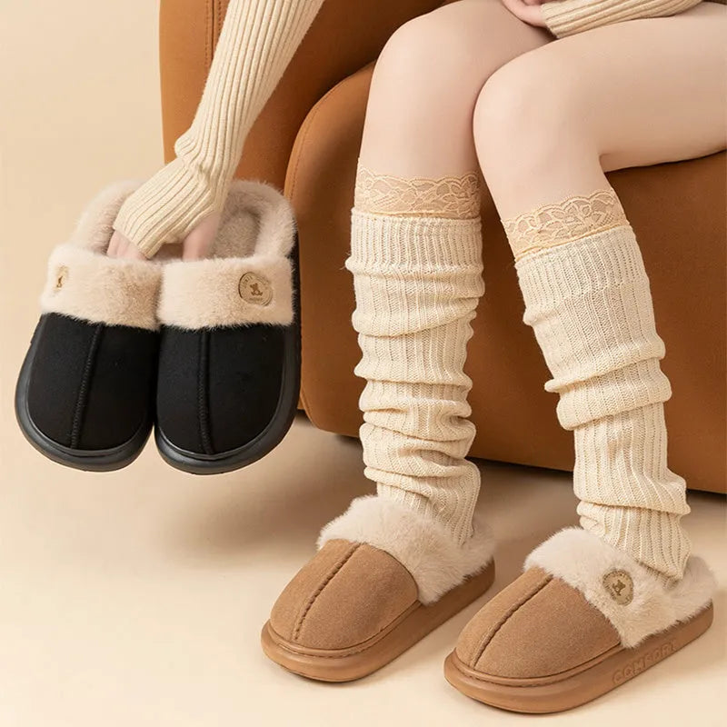 Plush fleece indoor slippers with PVC sole in five colour options showing car stitching detail