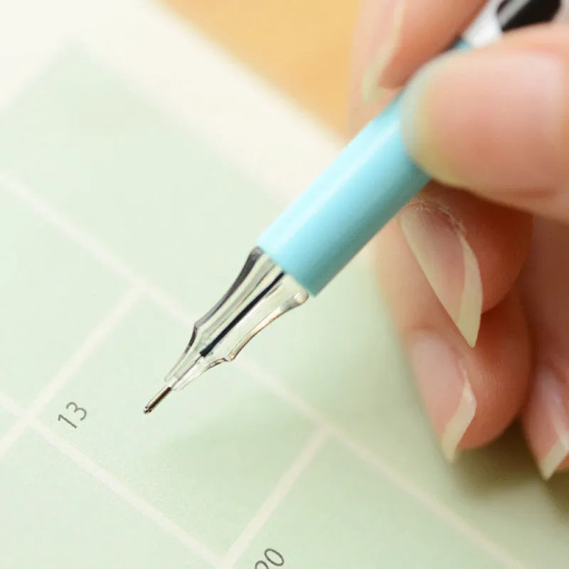 Box of 12 cow colour gel pens with 0.38mm fine tips on a desk.