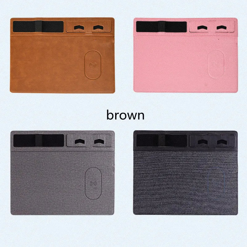 Pink wireless charging mouse pad with phone holder on a desk, showing USB cable and 320x260mm size.