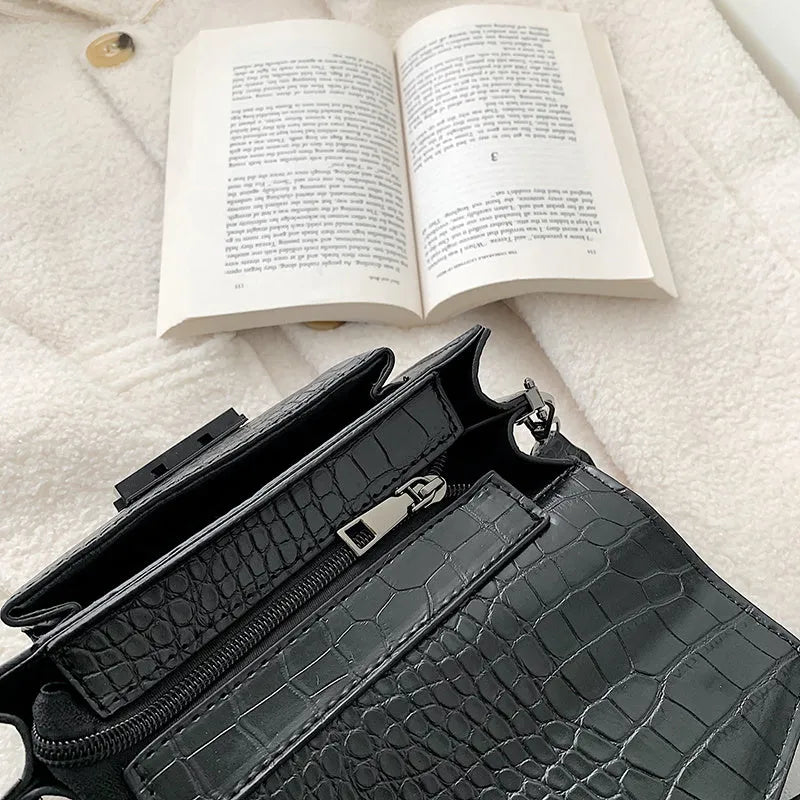 Vintage-style black PU leather crossbody bag with adjustable strap