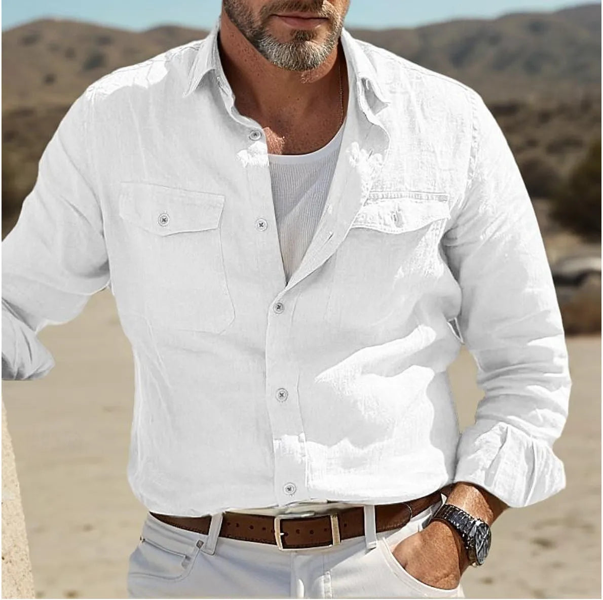 Men's long-sleeved loose fit shirt in a cotton linen blend, shown in solid green colour.