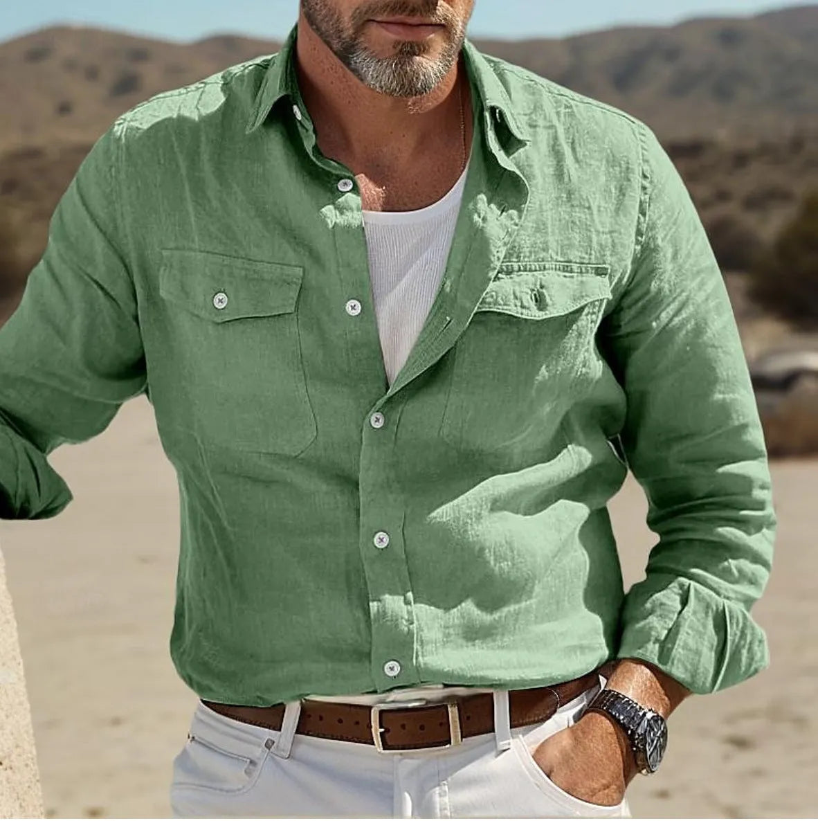 Men's long-sleeved loose fit shirt in a cotton linen blend, shown in solid green colour.