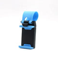 Black universal steering wheel phone holder clip mounted on a car steering wheel with a smartphone secured.