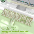 Matcha green mechanical gaming keyboard with multifunction knob on a desk