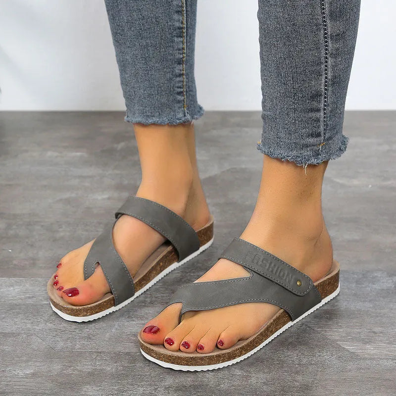 Flat toe ring flip-flops with a thick foam sole in a solid colour, shown in blue.
