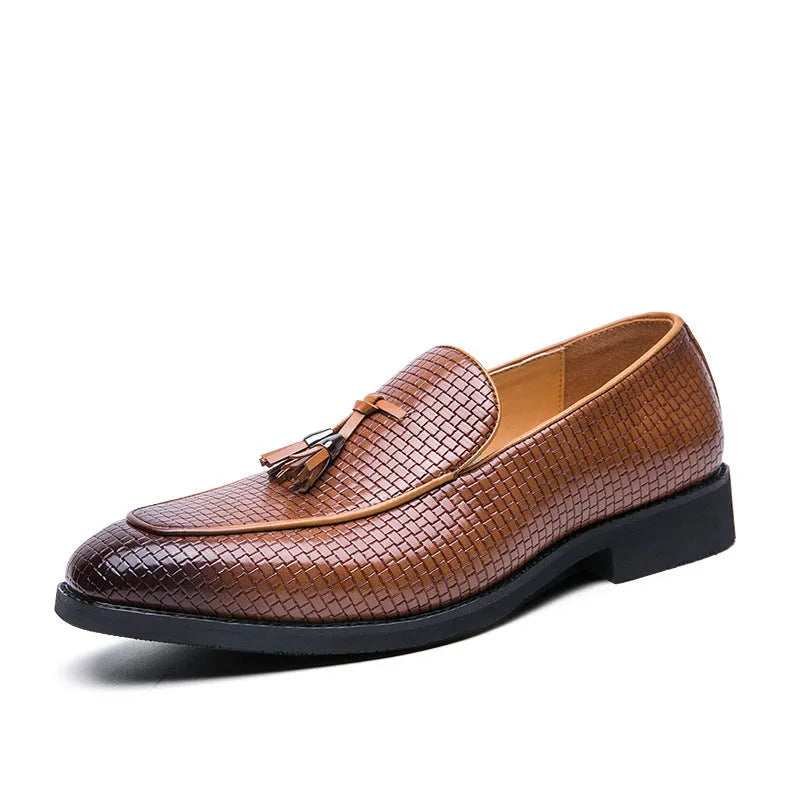 Men's black pointed-toe slip on shoes with a tassel detail on the low-top PU upper.