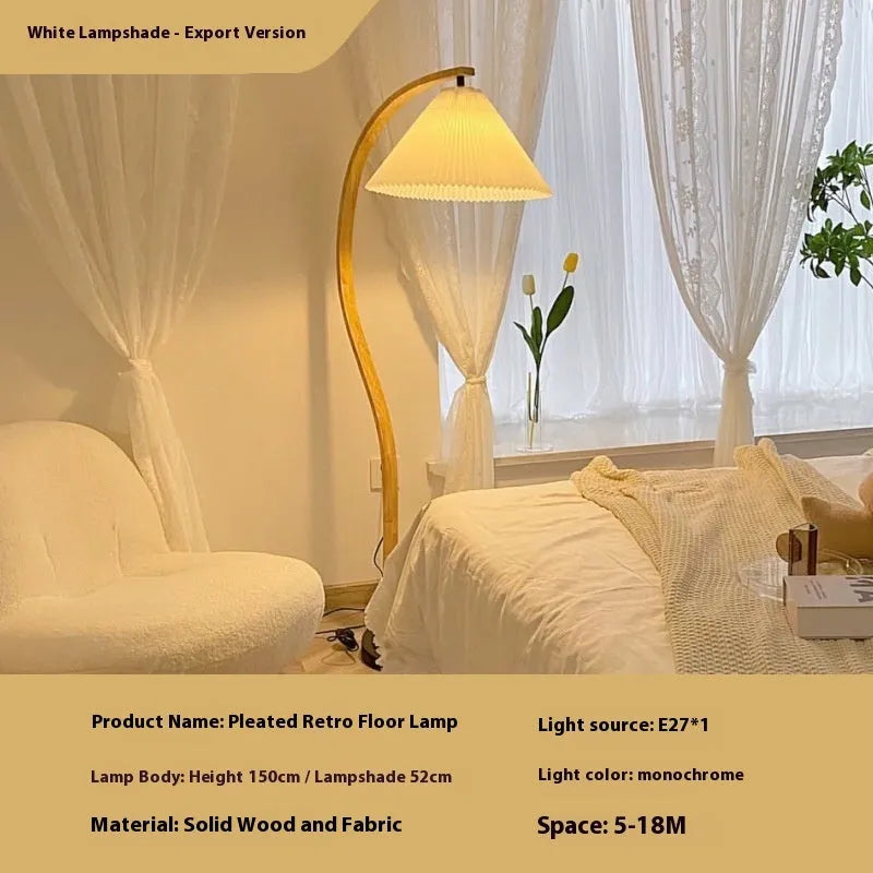 Vertical retro floor lamp with wood shade in three-colour variable light beside bed