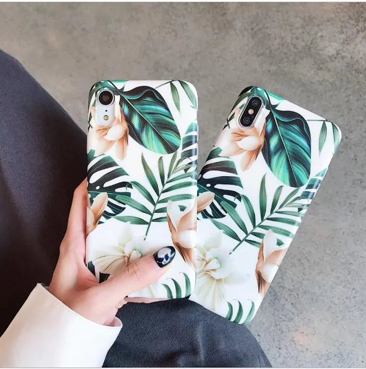 Soft TPU iPhone case with printed floral banana leaf design on the back.