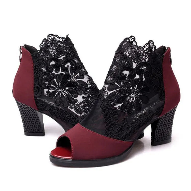 Women's black lace gladiator sandals with square heel, floral pattern, and peep toe design