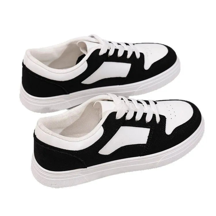 Black women's lace-up casual trainers with a round toe, low top, and rubber sole.