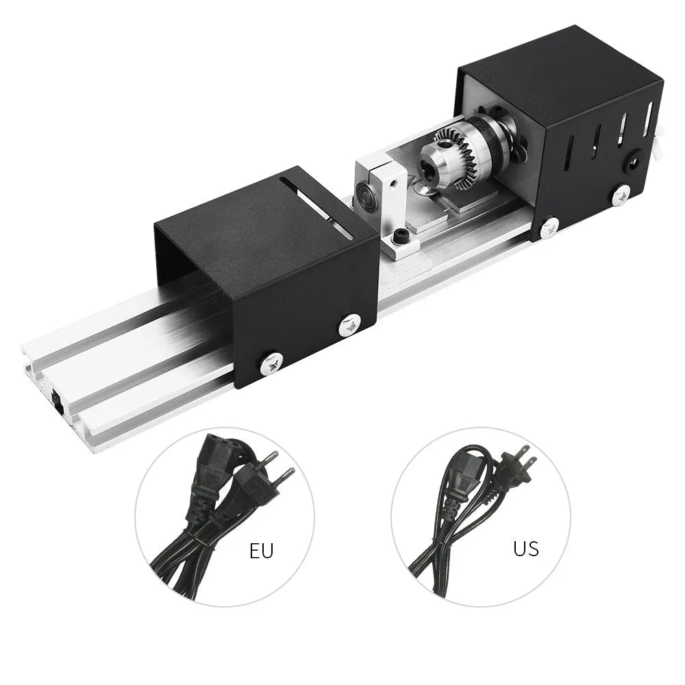 Mini metal woodworking lathe with silver finish and carving accessories on workbench