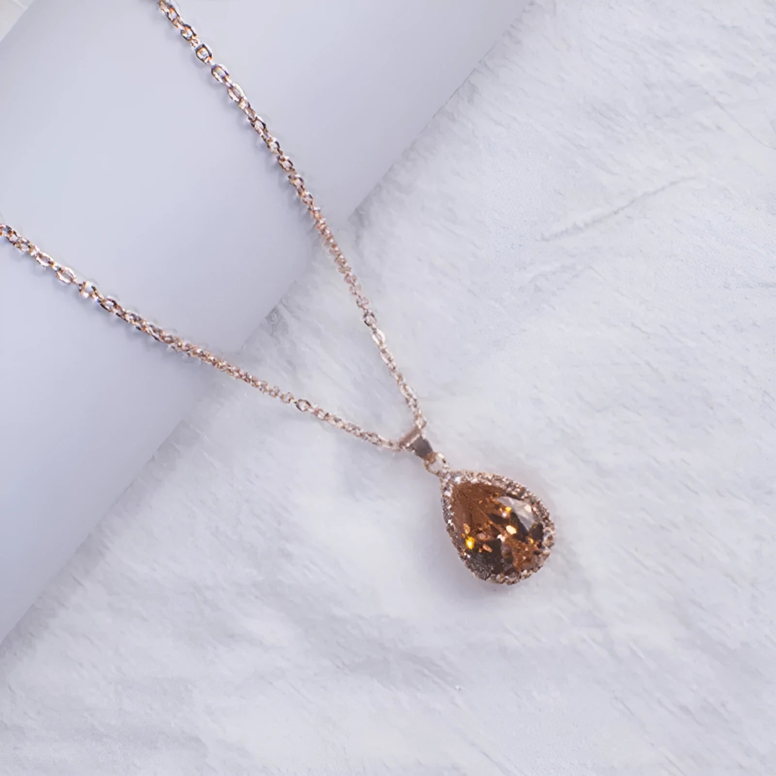 Rose gold geometric drop shape necklace with rhinestones in pink colour option