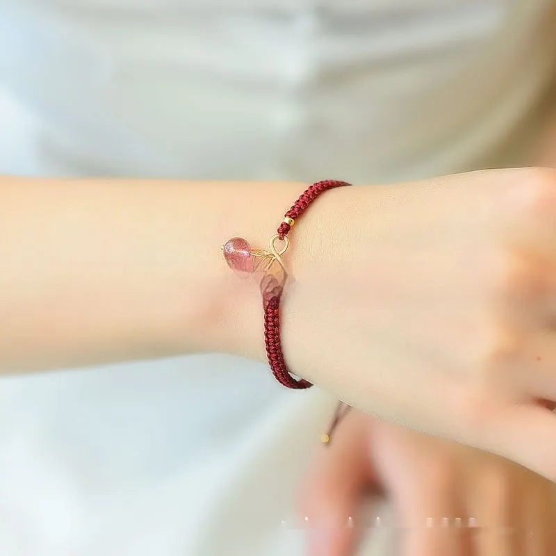 Women's natural strawberry quartz crystal bracelet with cherry charm on adjustable beaded band