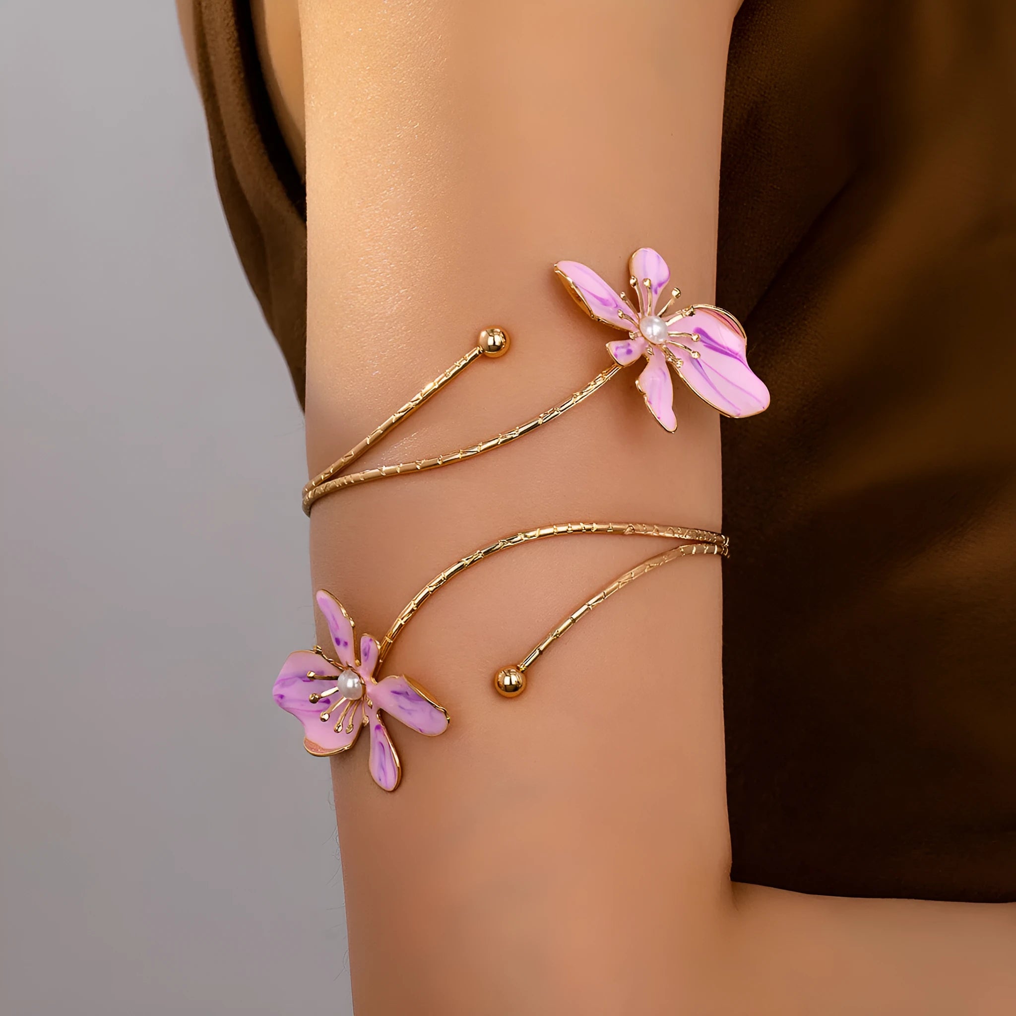 Adjustable alloy armband with hollow pattern design in pink or purple colour