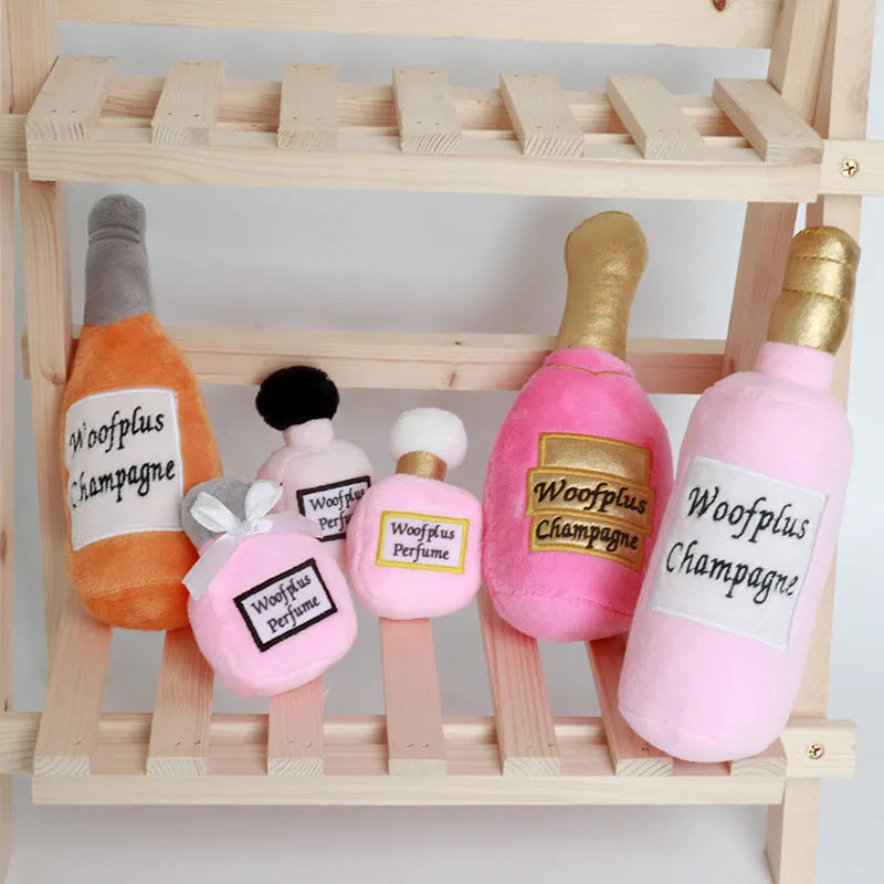 Green plush pet toy shaped like a wine bottle for dogs or cats to play with.