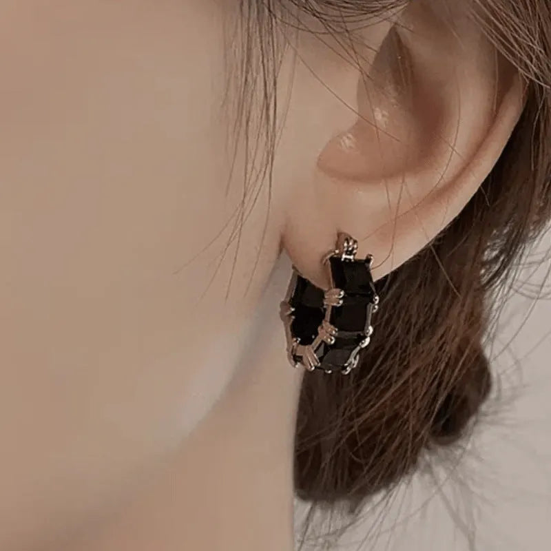 Gold-plated geometric ear ring with U-shaped design and round elements