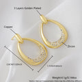 Women's geometric drop earrings with zircon details and yellow gold electroplated finish measuring 2.6 by 1.7 cm