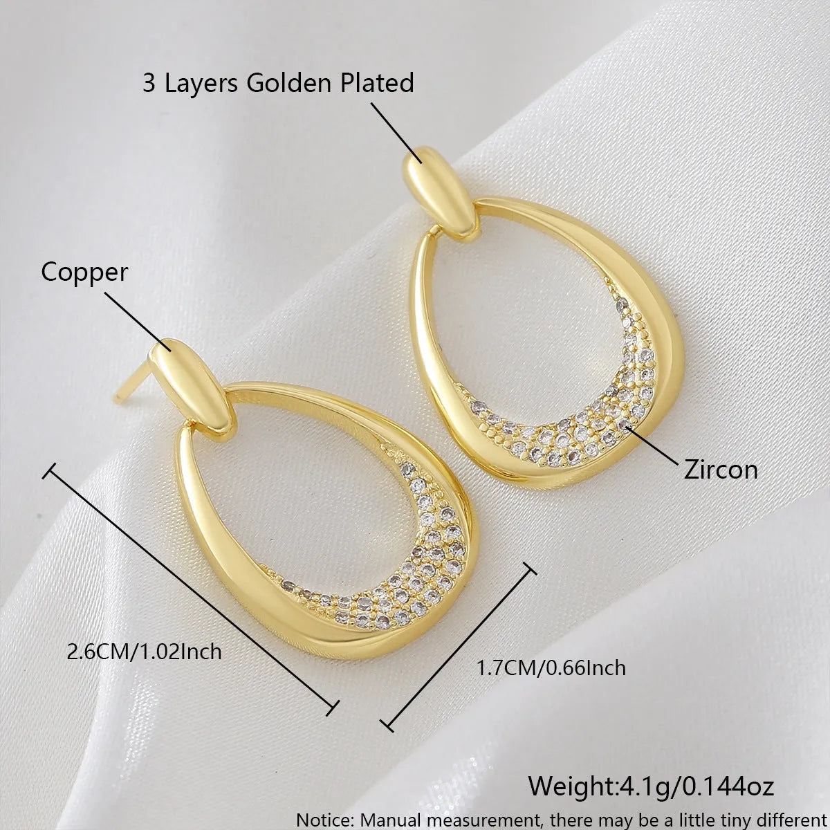 Women's geometric drop earrings with zircon details and yellow gold electroplated finish measuring 2.6 by 1.7 cm