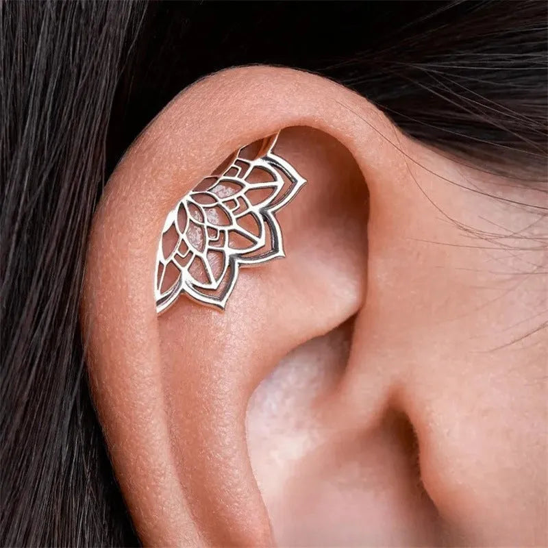Geometric spider web stud earrings with electroplated gold and silver metallic finishes