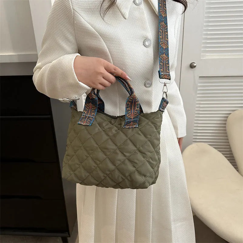 A soft Oxford cloth messenger bag in a horizontal square shape with a single shoulder strap, shown in one of five available colours.