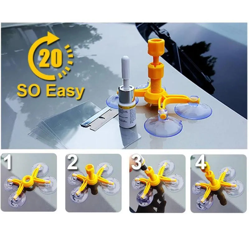 Windshield repair fluid kit with green resin, repair device, curing strips, and sleeved razor blade on a car windscreen