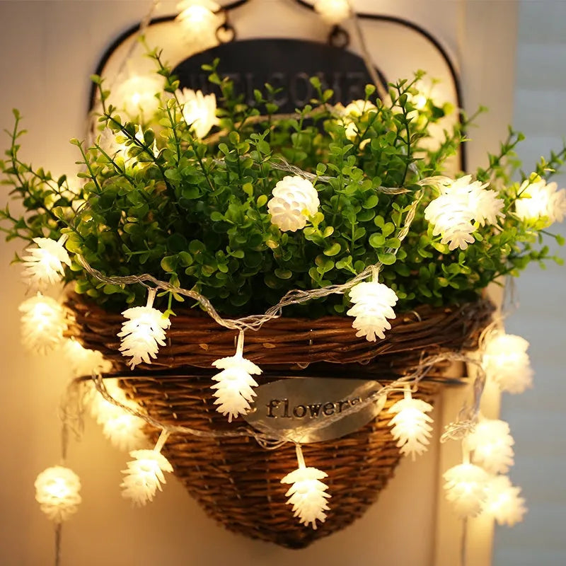 LED pine cone light string with plastic shell housing in warm white colour