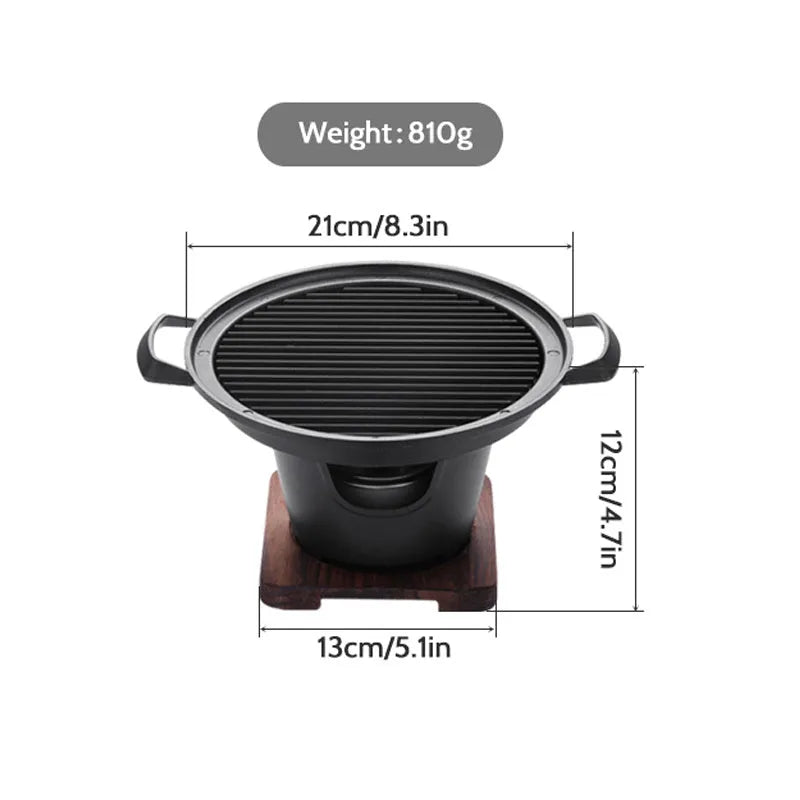 Mini BBQ grill alcohol stove with double-head flame and non-stick plate on tabletop