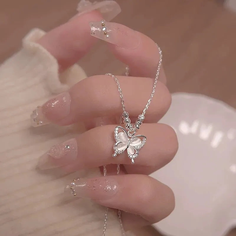 Women's adjustable 925 sterling silver necklace with a square opal butterfly pendant on a cross chain.