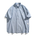 Blue striped unisex short-sleeve overall shirt in a loose cardigan style