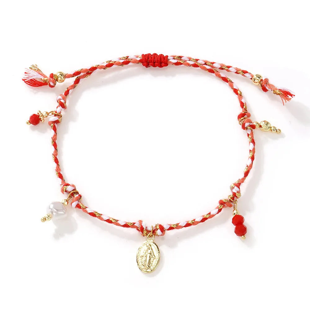 Close-up of a hand-woven colourful braided rope bracelet for women, showing textured ethnic style.