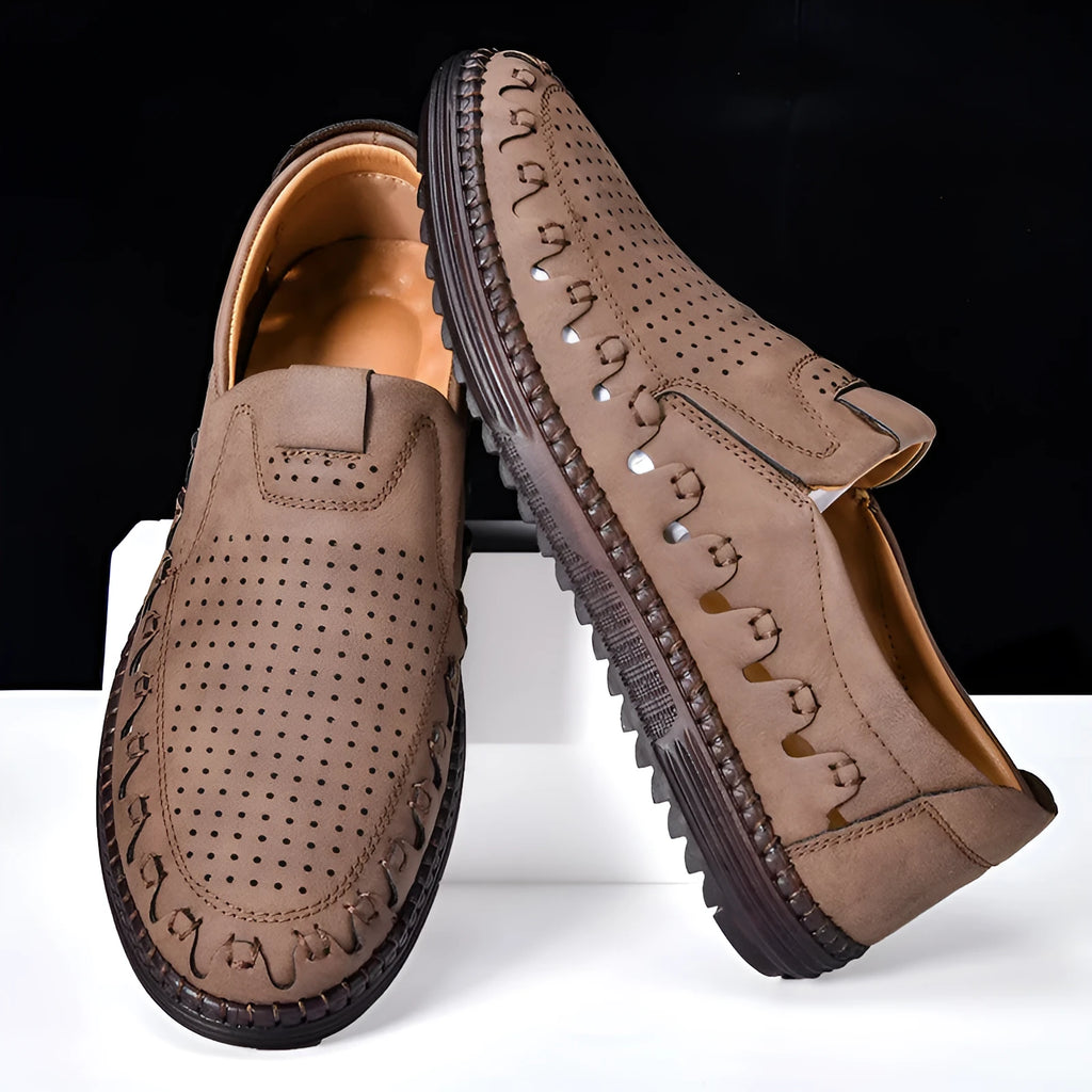 Men's brown slip-on casual shoes with round toe and flat heel on a white background