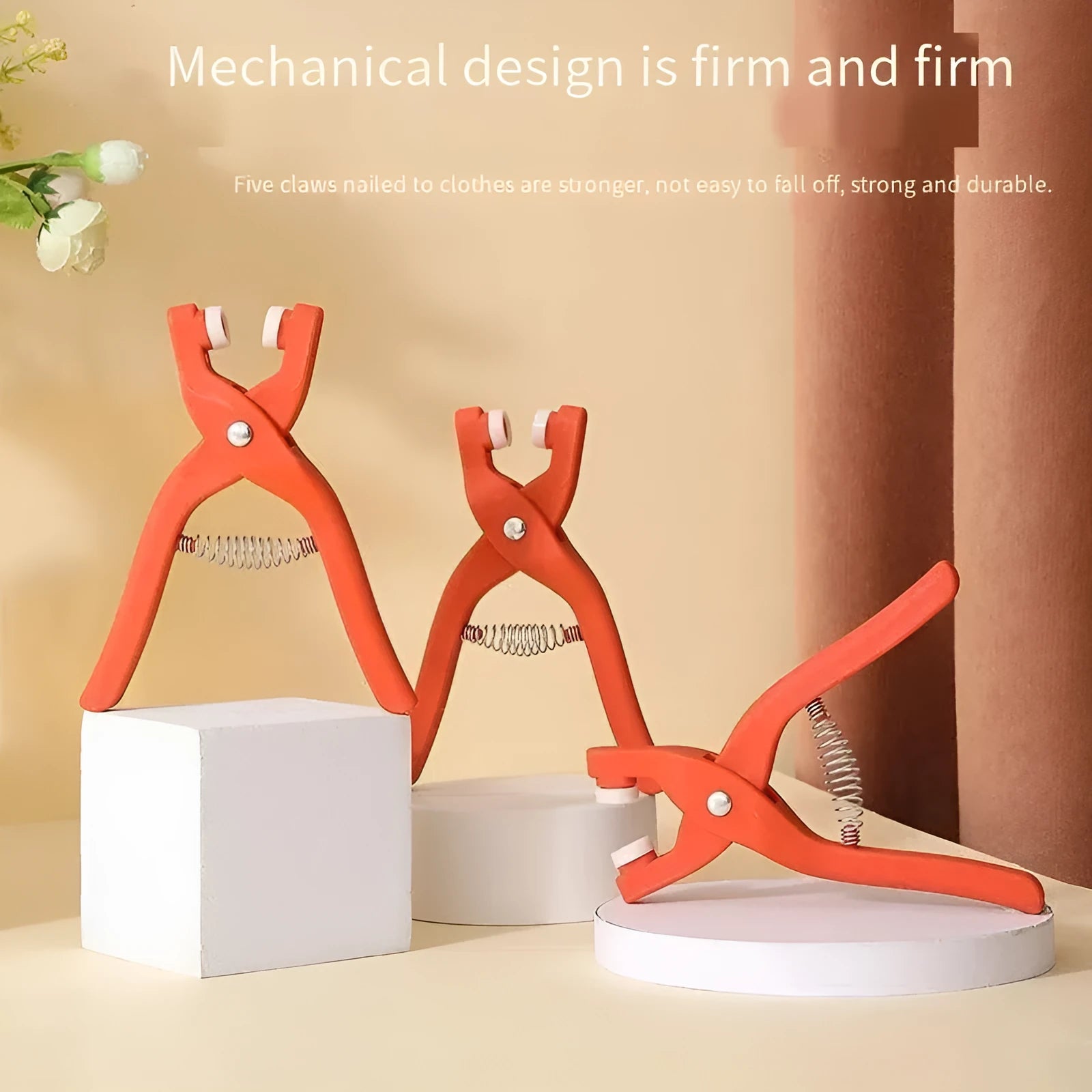 Five claw stainless steel no sew suit buttons for children's clothing, shown with plier tool.