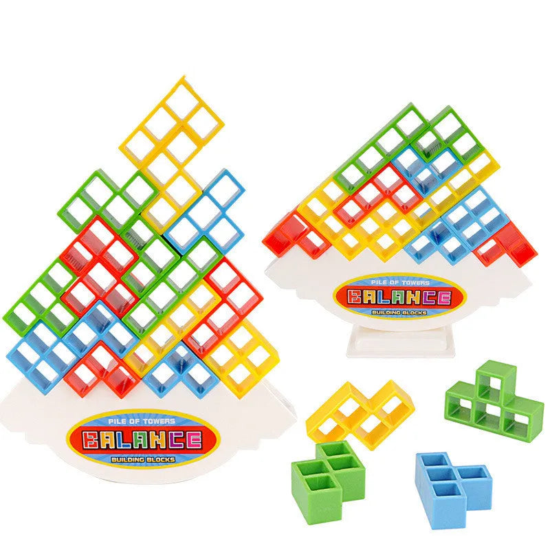 Plastic balance stacking board game with 16 coloured building blocks, chassis, and base on table.