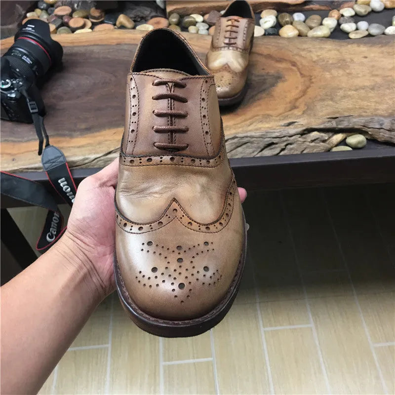 Men's light brown vintage leather casual shoes with carved distressed detailing and lace-up closure