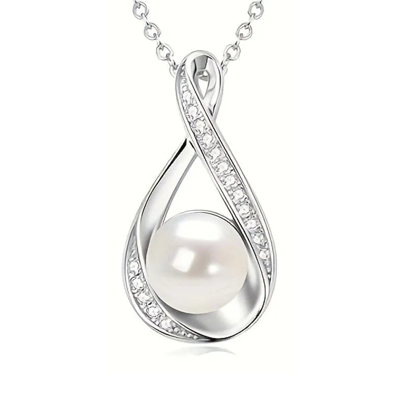 Alloy simulated pearl clavicle chain with diamond inlaid heart pendant, gold finish, on a white background