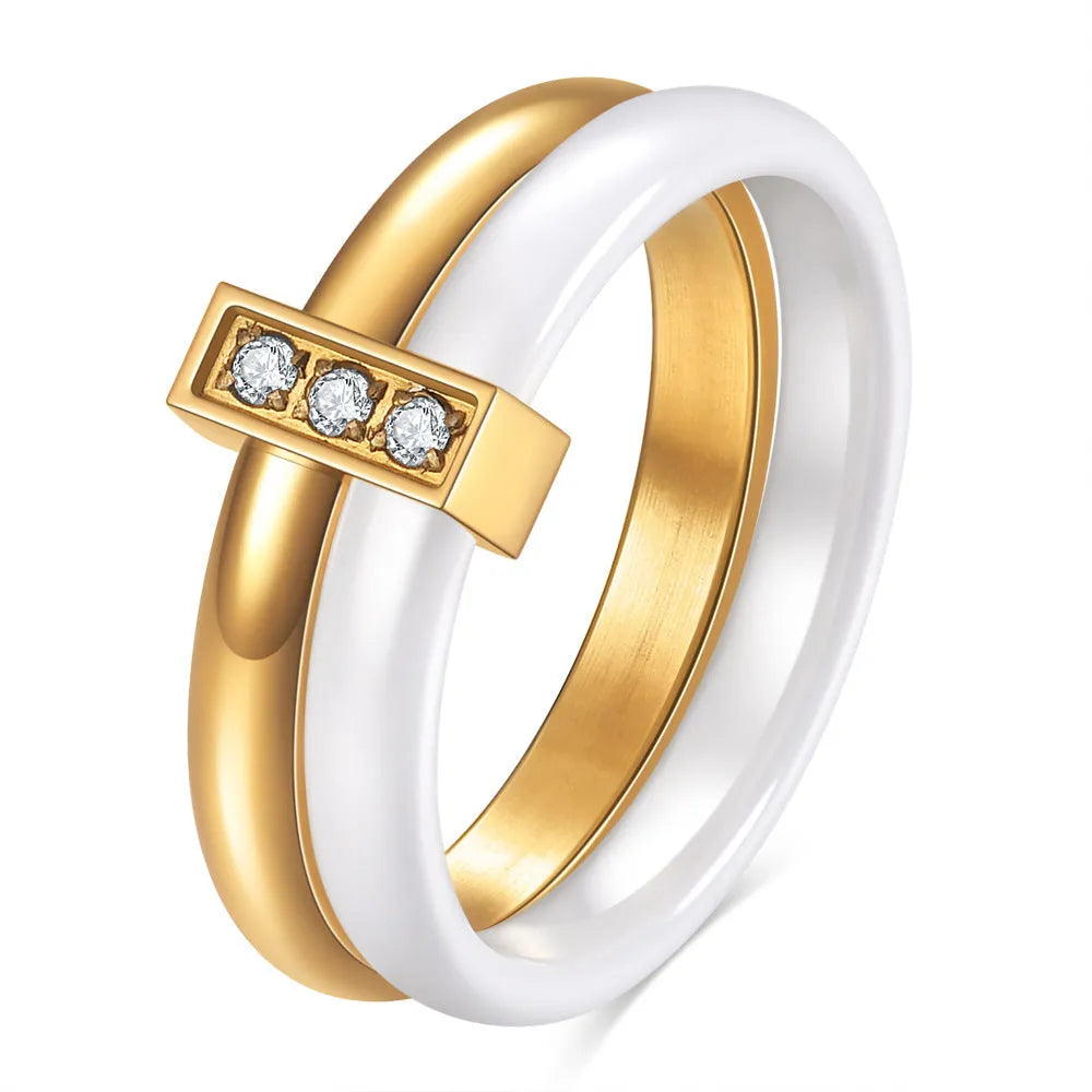 Steel black ceramic women's ring with glossy stitching and zirconium accents, geometric shape.