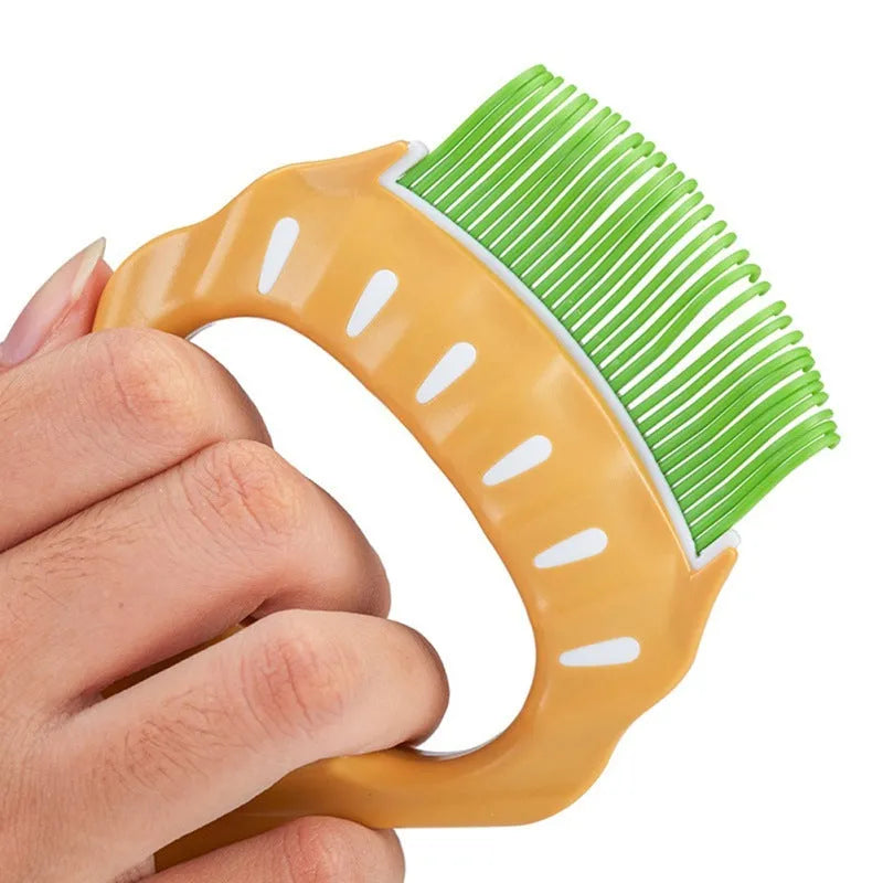 Shell-shaped pet grooming brush with bent wire bristles and anti-slip handle in green, orange, or purple colours
