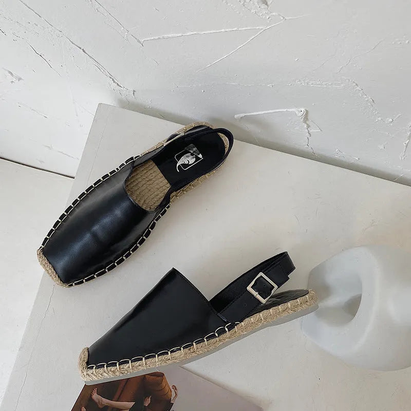 Women's beige retro fisherman flat sandals with canvas and soft leather upper, flat sole, and animal pattern detail.