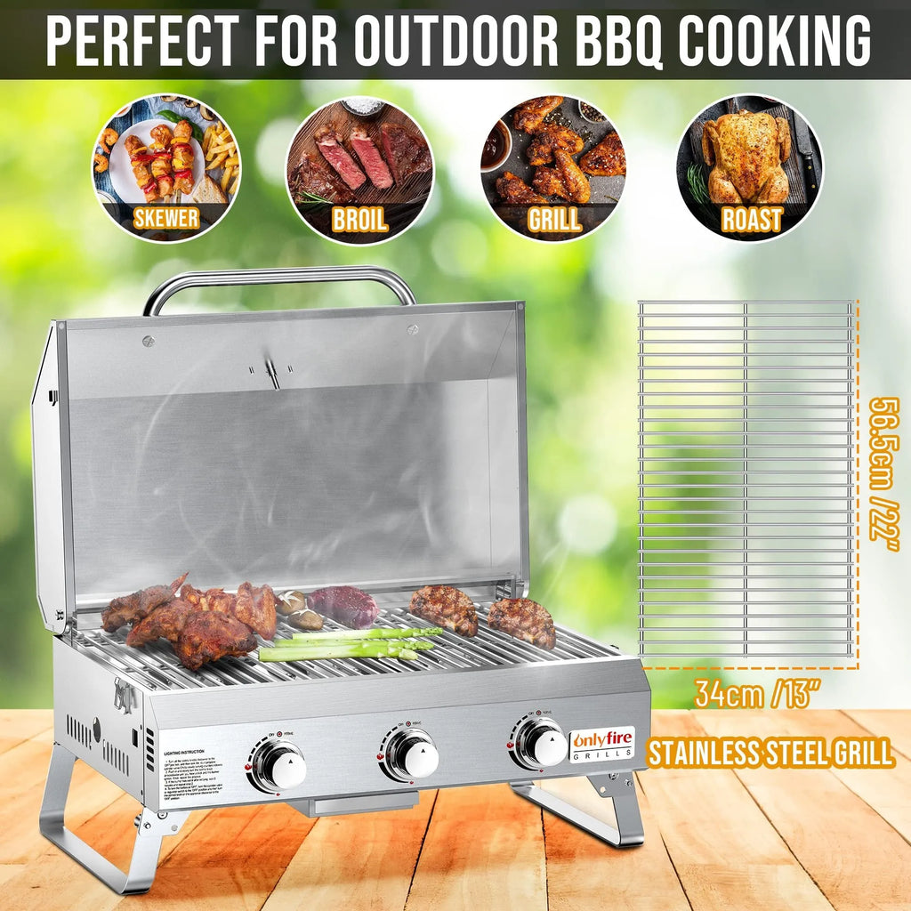 Silver portable desktop gas barbecue grill with three burners and foldable legs.