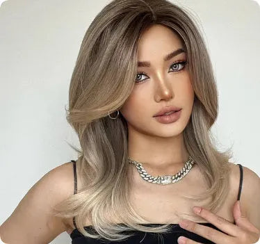 Mid-length synthetic wig with long curly hair, fringe, and platinum gradient colours