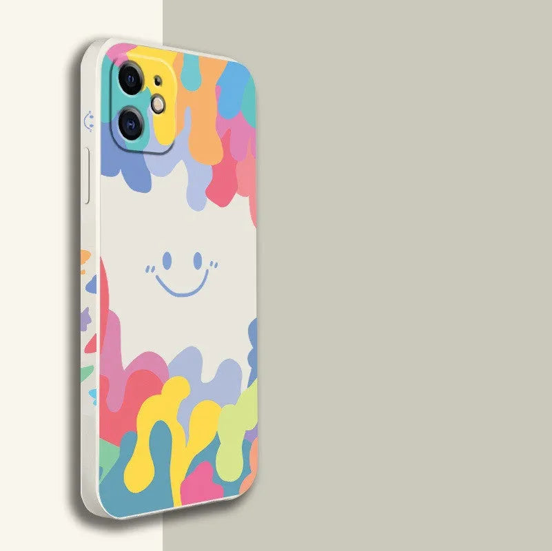 White silicone iPhone case with rainbow smiley face design and attached lanyard