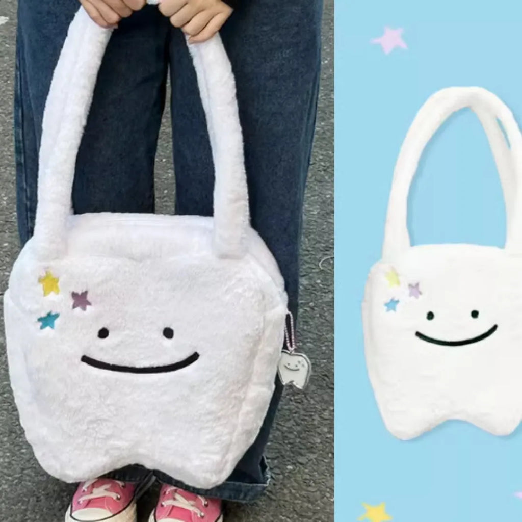 White plush shoulder tote bag with a large capacity and playful cute teeth design, shown with a crossbody strap.