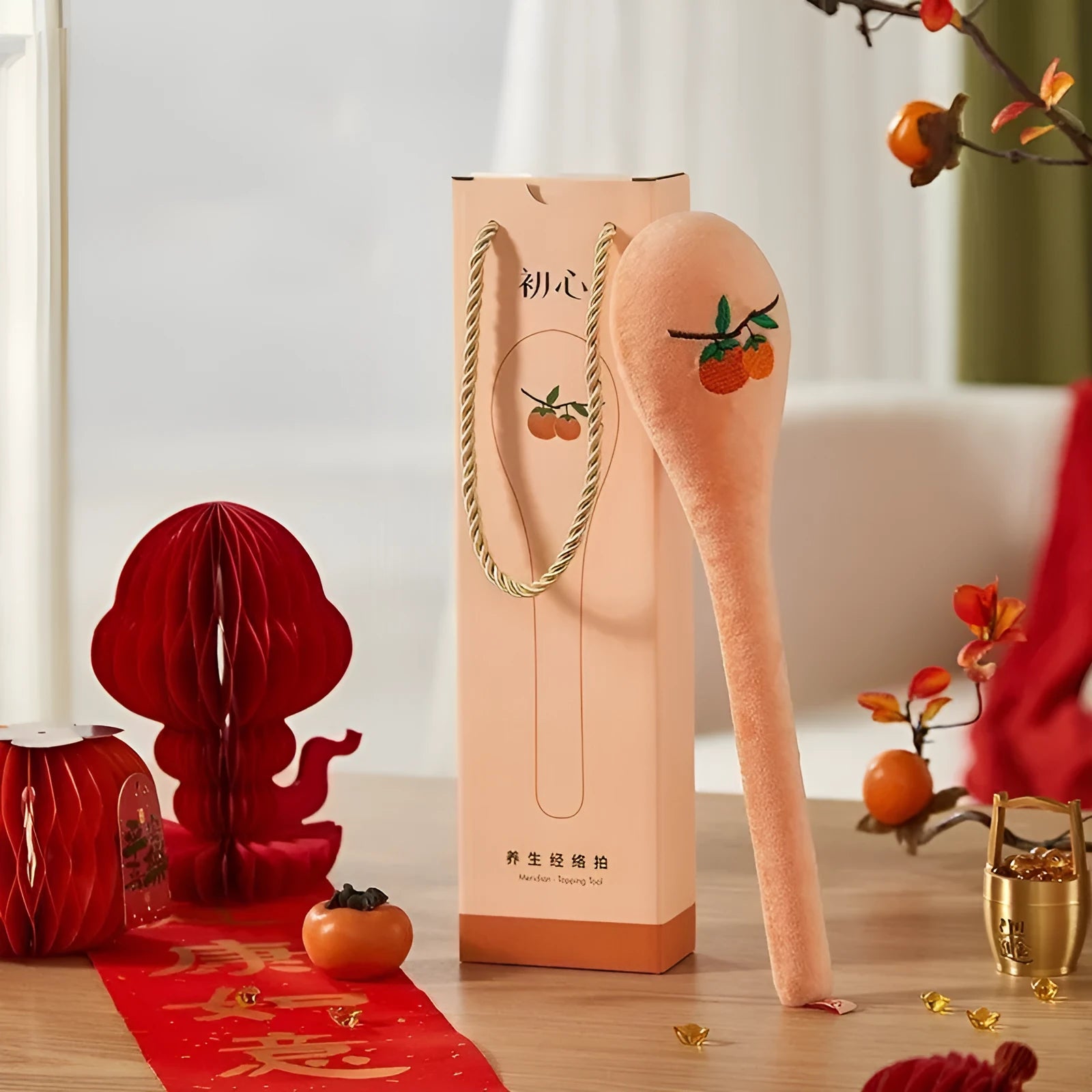 48 cm persimmon-coloured percussion massage stick with zipper closure and ergonomic handle