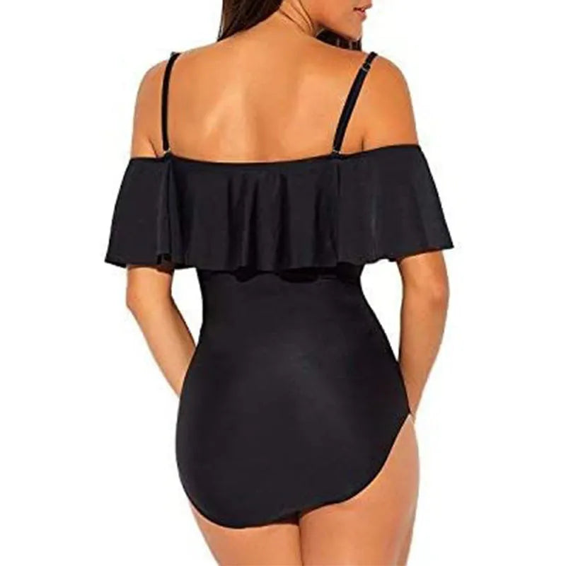 Black one-piece swimsuit with cut-out sections and ruffled strap detailing, tube top style