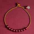Cinnabar and Hetian jade bracelet with geometric beads on adjustable hand-woven cord