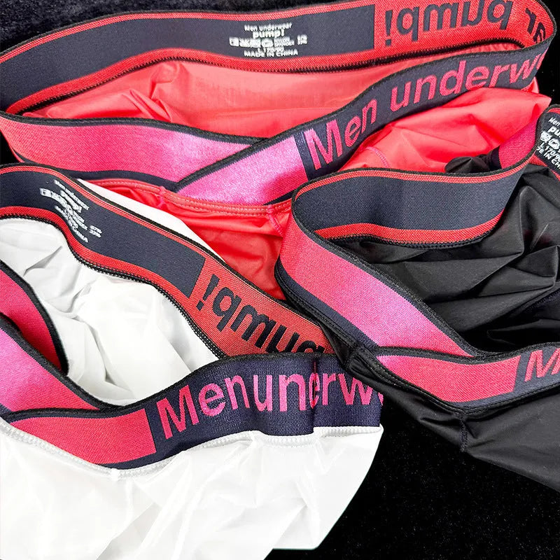 Men's low waist laser gradient underwear in black, red, and white colours with seamless construction