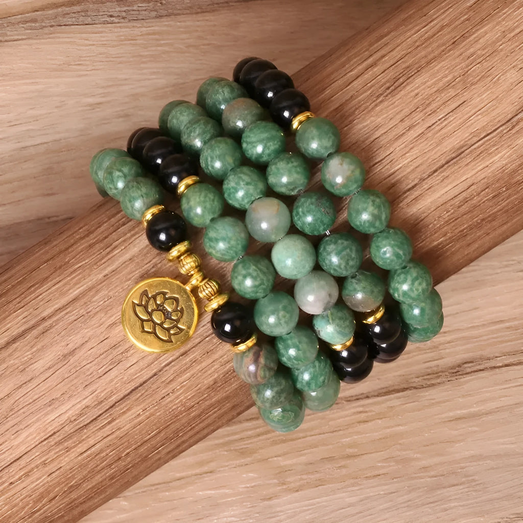 Green and black elastic beaded long bracelet made from alloy material.