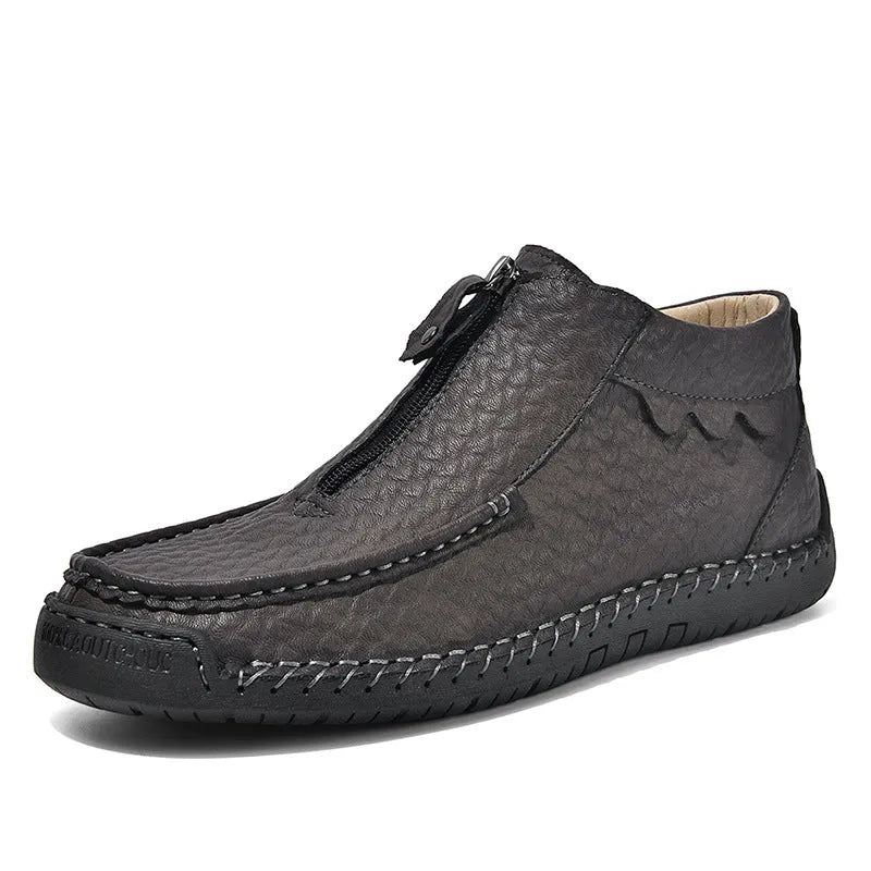 Men's black slip-on loafers with round toe and flat rubber sole on a white background.