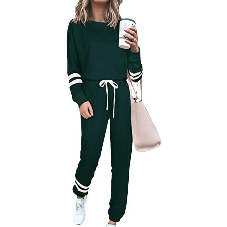 Women's plus size loose-fitting casual suit set in a solid colour, featuring a half-sleeve top and trousers.